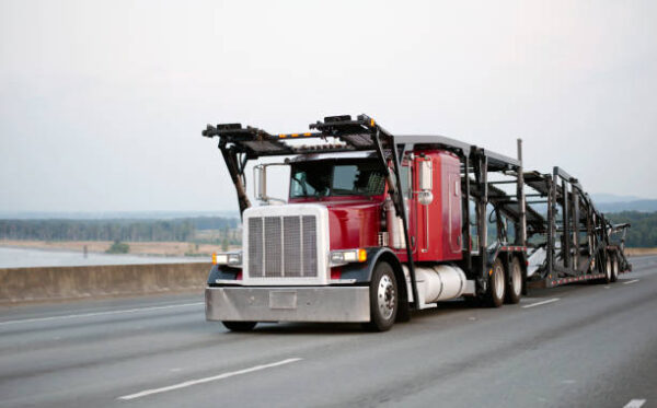 An open auto transport hauler
